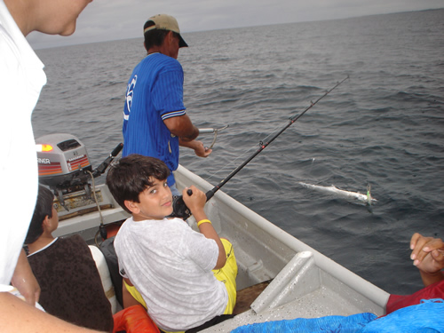Andres with spanish mackerel in the water. (Panama fishing).