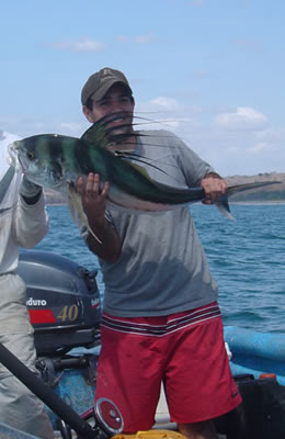 Jose Vera With Tourist And Rooster Fish.